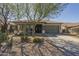 Charming single-story home featuring desert landscaping, a covered entry, and a two-car garage at 4315 W Phalen Dr, New River, AZ 85087