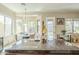 Well-lit kitchen with a large island and granite countertops leading to the breakfast nook at 4315 W Phalen Dr, New River, AZ 85087