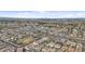 Vast aerial shot of a suburban area showcasing neatly planned streets and a community shopping center at 4321 E Zion Way, Chandler, AZ 85249