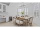 Bright and airy dining room with modern lighting and stylish furnishings at 4321 E Zion Way, Chandler, AZ 85249