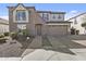 Charming two-story home with a stone facade, arched entry, and well-manicured landscaping at 4321 E Zion Way, Chandler, AZ 85249