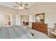 Spacious main bedroom featuring an ensuite bath access and walk-in closet at 43870 W Baker Dr, Maricopa, AZ 85138