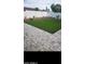 Beautiful backyard featuring an artificial lawn with a brick border and a white fence at 4606 E Cheyenne Dr, Phoenix, AZ 85044