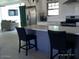 Open kitchen design with an island and seamless flow into the adjacent living area at 4606 E Cheyenne Dr, Phoenix, AZ 85044