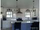 Bright kitchen with updated appliances, modern pendant lights, and a functional island at 4606 E Cheyenne Dr, Phoenix, AZ 85044