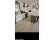 Stylish white kitchen featuring modern appliances, white subway tile and contrasting gray island at 4606 E Cheyenne Dr, Phoenix, AZ 85044