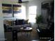 Inviting living room features stylish decor, including contemporary art and a plush sofa at 4606 E Cheyenne Dr, Phoenix, AZ 85044