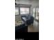 Comfortable living room with tile floors, a modern sofa, and views to the backyard at 4606 E Cheyenne Dr, Phoenix, AZ 85044