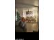 Bright and airy living room with modern furnishings, seamlessly flowing into the dining area at 4606 E Cheyenne Dr, Phoenix, AZ 85044