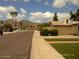Neighborhood street view showcasing a tidy street and desert landscaping with a mountain backdrop at 4606 E Cheyenne Dr, Phoenix, AZ 85044