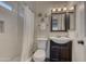 Modern bathroom with subway tile shower, dark vanity, and contemporary fixtures at 4826 W Michigan Ave, Glendale, AZ 85308