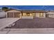 Charming home exterior featuring a well-maintained yard and a two-car garage, blending curb appeal with functionality at 4826 W Michigan Ave, Glendale, AZ 85308