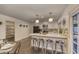 Bright and airy kitchen with a breakfast bar, modern appliances, and plenty of counter space for cooking at 4826 W Michigan Ave, Glendale, AZ 85308