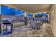 Relaxing outdoor patio area featuring a dining table, BBQ grill, and a beautiful view of the sparkling pool and backyard at 4826 W Michigan Ave, Glendale, AZ 85308