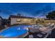 Inviting backyard pool with stone accents and ample space for lounging, perfect for relaxation and entertaining at 4826 W Michigan Ave, Glendale, AZ 85308