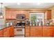 Functional kitchen featuring stainless steel appliances, dark countertops, and ample cabinet space at 4901 N 85Th St, Scottsdale, AZ 85251