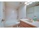 Neutral bathroom featuring a shower-tub combo, granite vanity, and tile floors at 5102 N 31St Pl # 436, Phoenix, AZ 85016