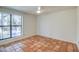 Bright bedroom with terra cotta tile floor and a large window with backyard view at 5102 N 31St Pl # 436, Phoenix, AZ 85016