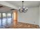 Bright dining room with chandelier lighting and sliding glass doors at 5102 N 31St Pl # 436, Phoenix, AZ 85016