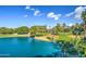 Stunning water view with trees and blue sky and white clouds enhances this home's outdoor appeal at 5102 N 31St Pl # 436, Phoenix, AZ 85016