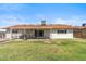 Expansive backyard with covered patio, perfect for outdoor entertaining and relaxation at 5255 W Caribbean Ln, Glendale, AZ 85306