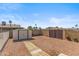 Private backyard with storage shed and gated entrance, offering ample space at 5255 W Caribbean Ln, Glendale, AZ 85306