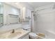 Bright bathroom featuring a shower, vanity with marble pattern, and a mirrored wall cabinet at 5255 W Caribbean Ln, Glendale, AZ 85306