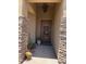 Welcoming front entrance with custom stone accents and a decorative wrought iron door at 6832 S 38Th S Pl, Phoenix, AZ 85042