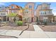 Charming townhome featuring stone accents, a well-maintained landscape, and a welcoming walkway to the front door at 7815 W Monte Vista Rd, Phoenix, AZ 85035