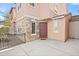 Charming townhome entrance featuring stone accents, a fenced front porch, and a welcoming 'HELLO' doormat at 7815 W Monte Vista Rd, Phoenix, AZ 85035