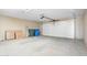 Attached garage with two car garage door and storage space at 7815 W Monte Vista Rd, Phoenix, AZ 85035