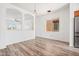 Bright living room showcasing an open layout, neutral color palette and durable wood-look floors and lots of natural light at 7815 W Monte Vista Rd, Phoenix, AZ 85035