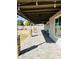 View of the backyard featuring the covered patio, stone pillars, and string lighting at 8139 W Columbine Dr, Peoria, AZ 85381