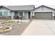 Inviting home with a neutral color palette, stone accents, and a well-manicured xeriscaped yard at 8139 W Columbine Dr, Peoria, AZ 85381