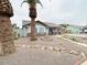 Attractive single-Gathering home with xeriscaped front yard and mature palm trees at 8139 W Columbine Dr, Peoria, AZ 85381