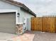 Side yard with wood fence and convenient gate access to backyard at 8139 W Columbine Dr, Peoria, AZ 85381