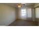 Cozy bedroom with natural light, carpet flooring, and a ceiling fan to keep you comfortable year round at 8255 E Kiva Ave # 424, Mesa, AZ 85209