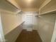 Spacious walk-in closet offers ample storage with shelving and rods, perfect for organization at 8255 E Kiva Ave # 424, Mesa, AZ 85209