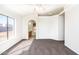 Bedroom featuring neutral carpet, ceiling fan, and abundant natural light at 8818 N 110Th Ave, Peoria, AZ 85345