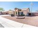 Inviting single-story home with a well-maintained, low-maintenance front yard landscape at 8818 N 110Th Ave, Peoria, AZ 85345