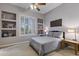 Cozy bedroom with shuttered window, built-in shelving, and neutral color palette at 9331 E Mclellan Rd, Mesa, AZ 85207