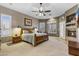 Main bedroom featuring a fireplace, and ample natural light with shuttered windows at 9331 E Mclellan Rd, Mesa, AZ 85207