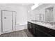 Modern bathroom with dual sinks, granite countertops, and glass-enclosed shower at 993 E Knightsbridge Way, Gilbert, AZ 85297