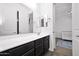 Modern bathroom featuring dark cabinets and white countertops at 993 E Knightsbridge Way, Gilbert, AZ 85297