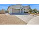 Well-maintained single-story home with a paved driveway and desert landscaping in the front yard at 993 E Knightsbridge Way, Gilbert, AZ 85297