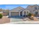 Attractive single-story home features a manicured front yard, stone accents and a two car garage at 993 E Knightsbridge Way, Gilbert, AZ 85297