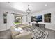 Comfortable living room featuring hardwood floors and sliding doors to the outdoors at 993 E Knightsbridge Way, Gilbert, AZ 85297