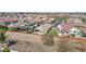 An aerial view of the rear exterior showing a private putting green and covered patio at 993 E Knightsbridge Way, Gilbert, AZ 85297