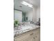 Bathroom featuring a granite vanity countertop, large mirror, and view of walk-in shower at 11011 N 92Nd St # 1157, Scottsdale, AZ 85260