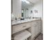Bathroom vanity with granite countertop and a large mirror at 11011 N 92Nd St # 1157, Scottsdale, AZ 85260